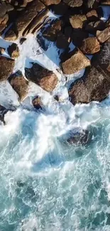 Aerial view of ocean waves crashing against rocky coastline, creating foam.