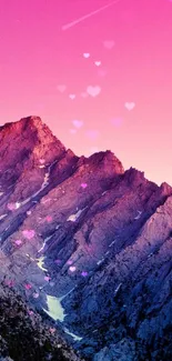 Pink sunset over mountain peaks wallpaper.