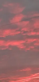 Pink sunset sky wallpaper with clouds.