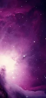 Purple nebula wallpaper with stars and cosmic light.