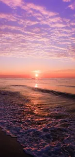 Purple sunset over ocean waves with soothing sky.