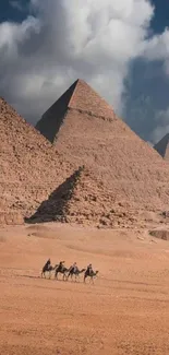 Pyramids of Giza under a dramatic, cloudy sky