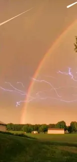 Colorful rainbow arcs over a field with lightning.