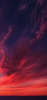 Dramatic red and black sunset sky, ideal mobile wallpaper.