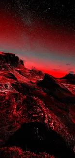 Red mountain landscape under starry night sky.