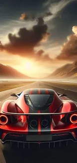 Red sports car driving into a sunset on an open road.