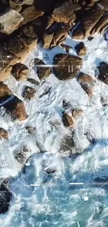 Aerial view of ocean waves crashing on rocky coastline.