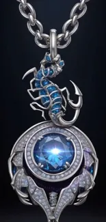 Silver scorpion pendant with blue gemstone on dark background.