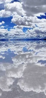 Reflection of sky and clouds on a calm lake with vibrant blue tones.