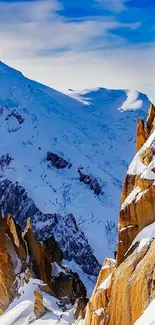 Snowy mountain range with blue sky.