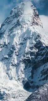 Snow-covered mountain peak under a blue sky, perfect for mobile wallpaper.