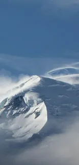 Snow-covered mountain peak against a clear sky.