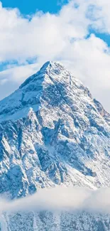 Snowy mountain peak under clear blue sky, perfect for nature photography enthusiasts.