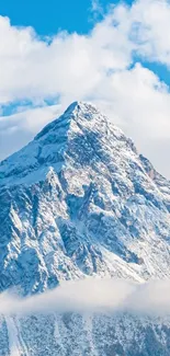 Majestic snowy mountain peak under clear blue sky.