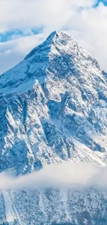 Snowy mountain peak under a clear blue sky.