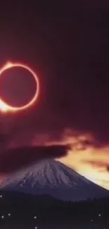 A breathtaking solar eclipse over a mountain under dark clouds and colorful sky.