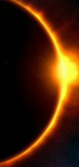 Solar eclipse with vibrant orange glow and dark background.