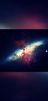 Vibrant galaxy wallpaper with stars and nebulae in dark blue and red hues.