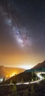 Mobile wallpaper featuring a stunning Milky Way over a winding mountain road.