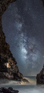 Starry night view through dramatic cave