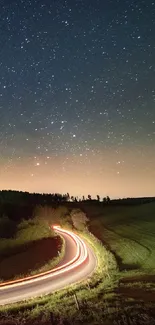 Starry night sky over a winding road.