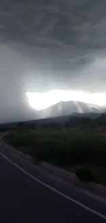 Stormy mountain landscape with dramatic clouds.