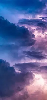 Purple storm clouds with lightning in a dramatic sky.