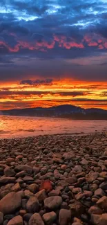 Breathtaking sunset over rocky beach with vibrant sky