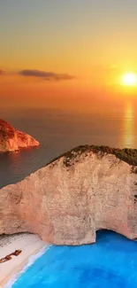 Beautiful sunset over a rocky beach with vibrant blue waters and golden sky.