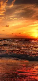 Vivid sunset over ocean waves creating a peaceful beach scene.