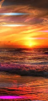 Beautiful sunset over ocean with vibrant orange sky.