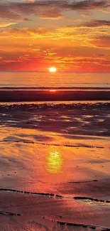 Beautiful orange sunset over a tranquil beach reflecting on calm ocean waves.