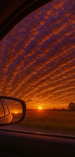 Breathtaking sunset view through a car window with vibrant skies.
