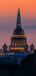 Majestic cityscape at sunset with an orange and blue sky background.