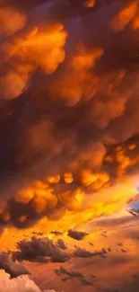 Breathtaking sunset with dramatic orange clouds filling the sky.