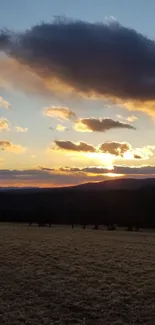 Serene sunset over open field with stunning cloud formations.