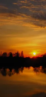 Orange sunset over water reflecting the sky.