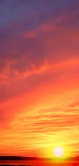 Vibrant sunset wallpaper with orange sky.