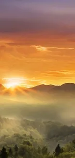 Stunning sunset over misty mountain landscape wallpaper.