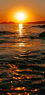 Stunning sunset over the ocean with golden reflections.