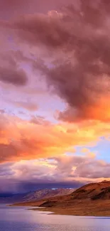 Stunning sunset over mountains with vibrant clouds.