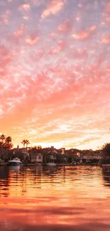 Stunning sunset reflecting on calm water with vivid orange sky.