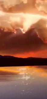 Captivating sunset with glowing orange sky reflected on calm water surface.