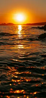 Golden sunset reflecting over a calm ocean.