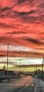 Dramatic sunset over a city street with vibrant orange skies.