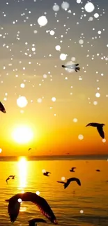 Birds flying across a sunset sky over a calm ocean with gentle waves.