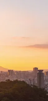 Taipei skyline at sunset with orange sky and tower views.