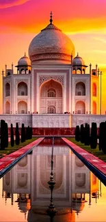 Taj Mahal at sunset with vibrant colors and reflection.