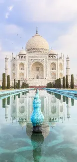 Taj Mahal reflected in serene water with a clear sky background.