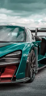 Teal sports car on open road, exuding speed and sleek design.